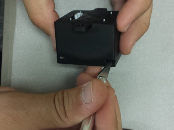 You might have to remove a bit of PLA overhang support from the screw holes.