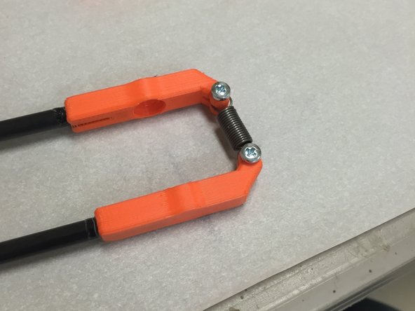 Now take the remaining rods and attach them to the other side of the spring.