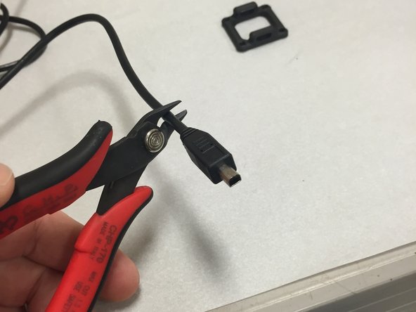 Use a pair of wire cutters and chop off the weird connector end.