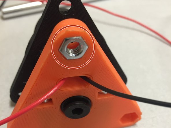 Press the three M5 nuts into the nut traps in the 3DAT0017.  Use a pair of needle-nose pliers to get them flush.