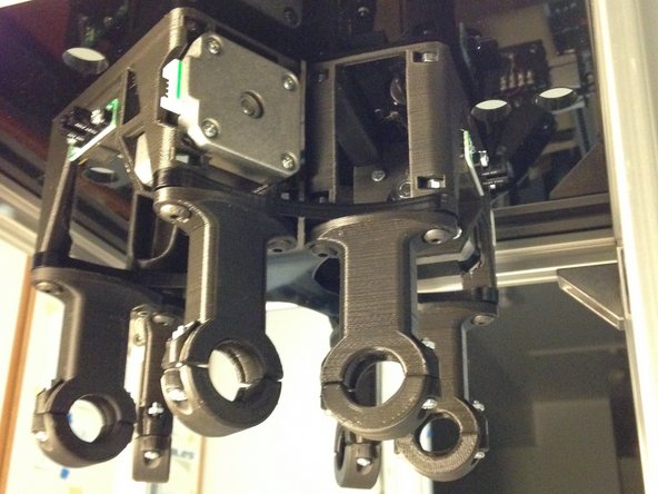 Attach motor plate to top plate using M5 x 14L button-head cap screws and M5 nuts previously inserted in to the stepper mount.