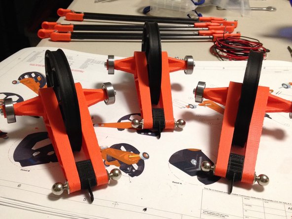 Place delta pulley assembly onto delta bearing block holder.  Make sure that the FLAT side of the pulley is facing AWAY from the stepper motors.