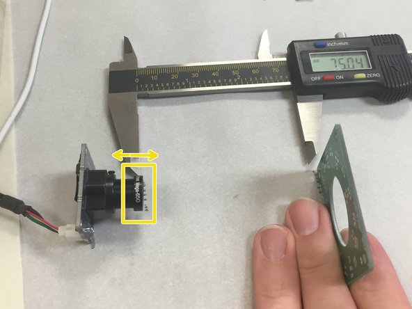 Loosen the little set screw on the side of the camera M12 screw housing.