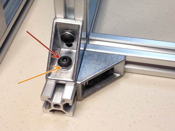 Slide extrusion nut into rail from the end.