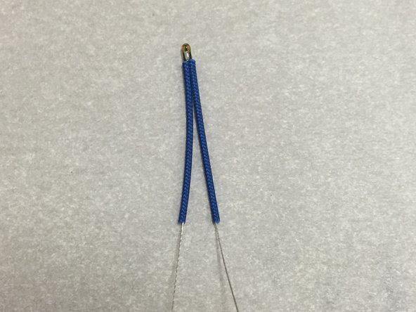 Find the thermistor (the little glass bead with the wires).