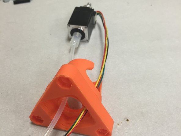 Use the included M2 pan-head screws to secure the stepper motor into place.  Do not over-tighten.