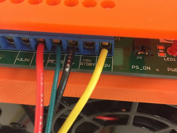 Ensure that the ATX power supply power connections are made as shown in the first image.