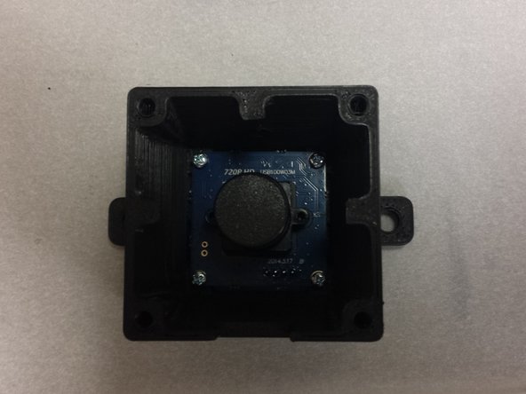 Use four M2 x 8mm pan-head machine screws to fasten the camera to the housing.