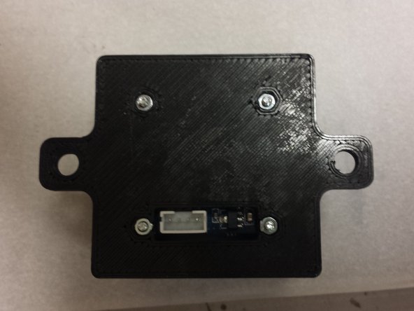 Use four M2 x 8mm pan-head machine screws to fasten the camera to the housing.