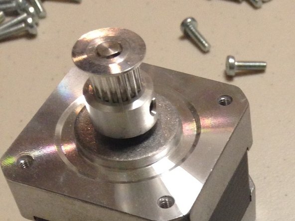 Attach the DGP16T pulley (GT2, 16-tooth) onto the 5mm stepper shaft.