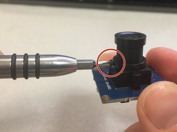 Before placing the camera into the housing, we will adjust the focus.