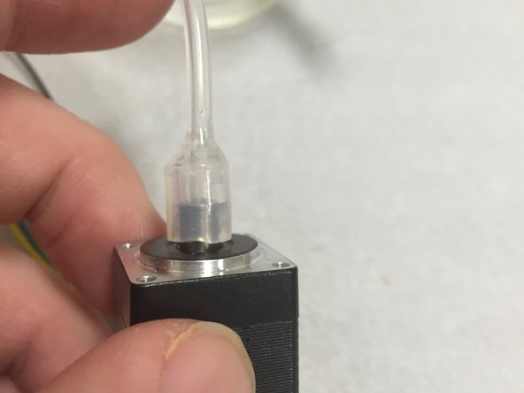 Add the epoxy to the gap between the large and small silicone tubes.