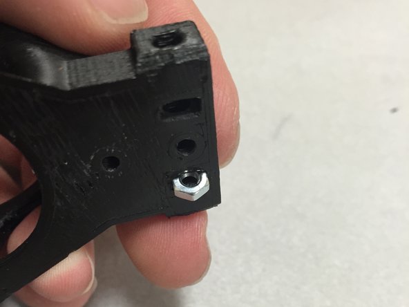 Do these one at a time.  Otherwise the others may fall out.  Insert the first M3 nut and then move onto the next step.