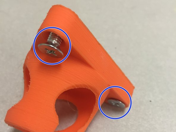 Insert the M5 flat-head screws into the three holes, as shown.