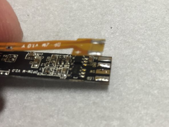 Do this by heating one pad up, and twisting the cable so that the side moves away from the pad