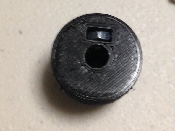 Insert M3 nut into gear