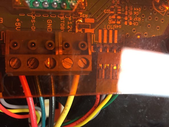 The other side of those wires should connect to the EMC02 motion controller.  The wires should be cable-tied to the frame, and clear of any moving parts.