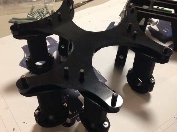 Attach delta arm mechanism to acrylic delta motor plate using M5 x 20mm button-head cap screws
