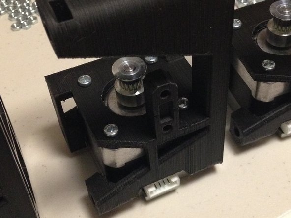 Insert stepper motor into 3D00456c stepper bracket, ensuring that the stepper motor electrical connector is positioned on the correct side, as shown.