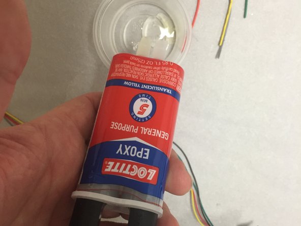 Mix up a bit of 2-part epoxy (not included in the kit).  General purpose clear epoxy should work fine, this can be purchased from any hardware store, and even most big-box stores in the hardware section.