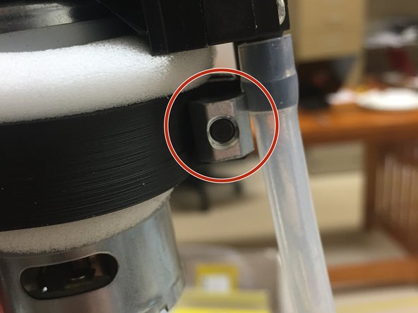 Add an M5 x 14mm screw through the clamp.