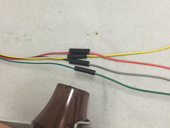 Solder the wires together, using the same color (the exception being gray -- use the black wire for this).