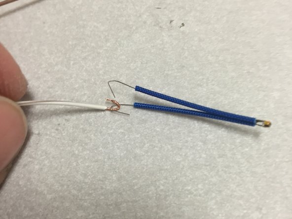 Form the thermistor leads and the twisted pair wire into hooks.