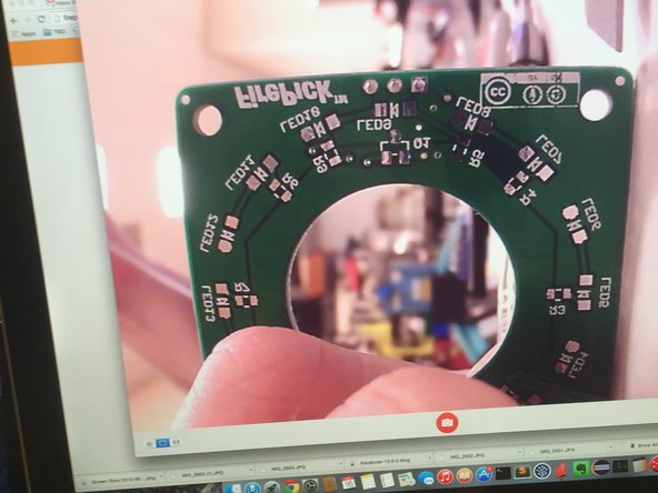 Using a piece of paper and a small PCB or business card to make a focus-setting jig.  Set the business card about 75mm away from the tip of the camera lens.