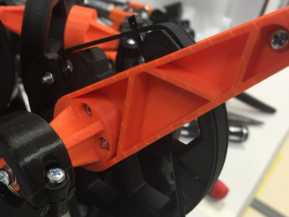 Thread it through the other side, as shown in the first picture.