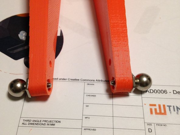 Attach ball-stud to arm