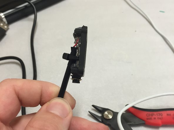 Use a zip-tie to hold the USB cable to the camera module.