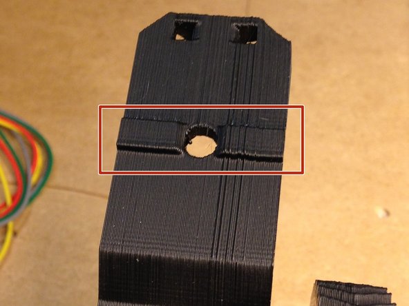 Trim the mounting bracket by removing a small portion of the ridge on the arm.  See pictures.
