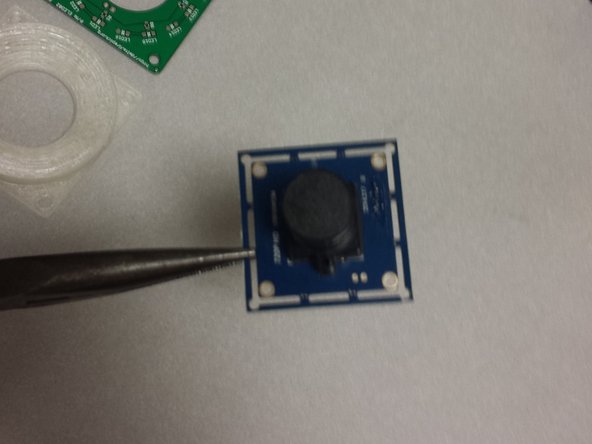 The ELP USB camera comes from the factory with a frame.  Carefully snap this off using a pair of needle-nosed pliers.