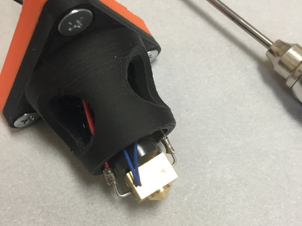 Thread the twisted pair through the cable slot in the 3DAT0017.  Pull the twisted wire through until the thermistor is roughly lined up with the hotend as shown in the picture.