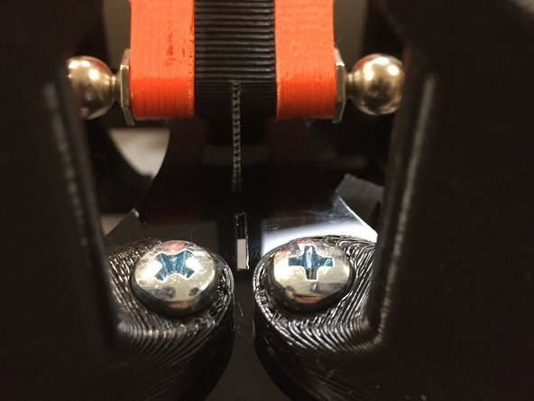 Flip your pulleys around the other way, you'll see some little slots in the acrylic plate.  Use those marks to ensure that the optical interruptors line up with the slot.  If so, then the mechanism is in good alignment.