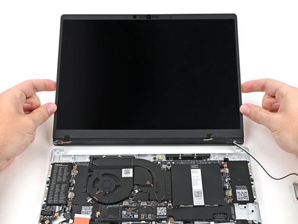 Place the Top Cover on its two sets of alignment pegs on the Bottom Cover.