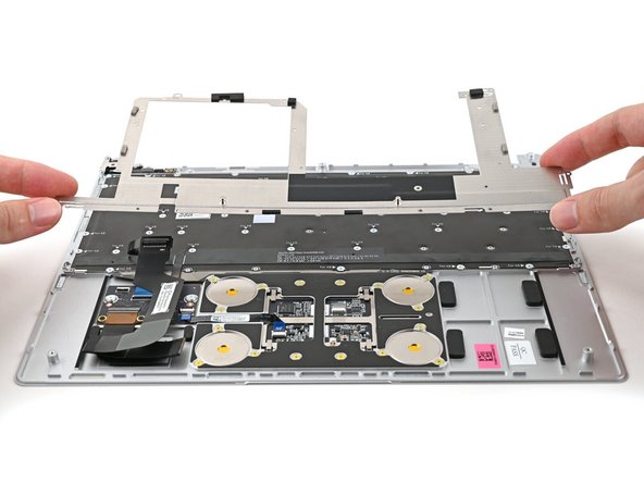 Place the Keyboard Bracket onto its alignment pegs.