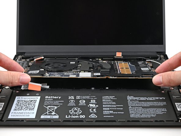 Lift the Mainboard off its alignment pegs and remove it.