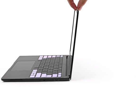 Open the laptop so the screen sits flat on your work surface.