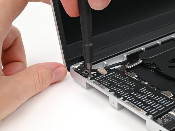 While supporting the Top Cover with one hand, use your Framework Screwdriver to install two 4.0 mm‑long T5 Torx screws on each Hinge connected to the Bottom Cover (four total).