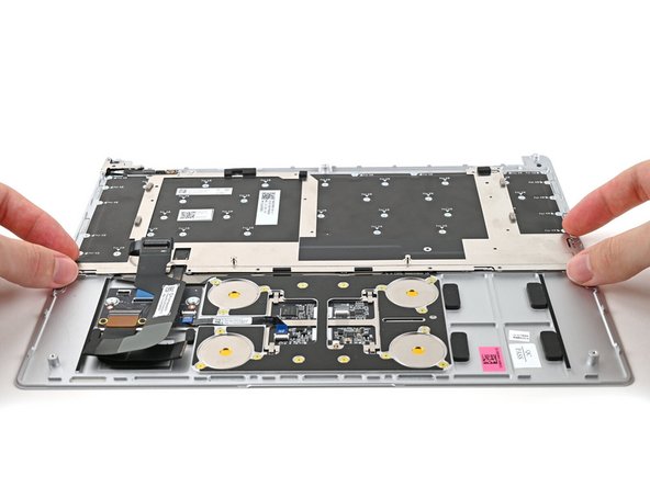 Place the Keyboard Bracket onto its alignment pegs.