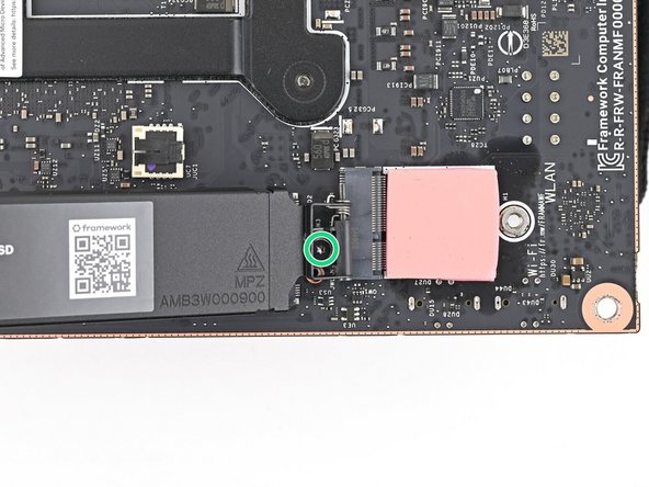 If your SSD comes with a pre-installed heat spreader, follow the next two steps. Otherwise skip to Step 5.