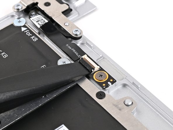 Use the flat end of your Framework Screwdriver, or a clean fingernail, to lift up the locking tab on the Fingerprint Reader ZIF connector located on the Fingerprint Reader board.