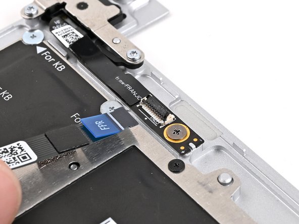Slide the Fingerprint Reader Cable straight into its socket.