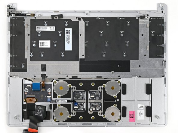 Use your Framework Screwdriver to install the twenty 1.3 mm‑long silver PH0 screws securing the Keyboard Bracket.