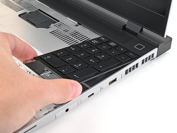 Align the top edge of the Input Module with the top edge of the laptop.