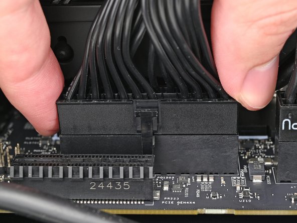 Slide the cable into its socket on the Mainboard until you feel its clip click into place.