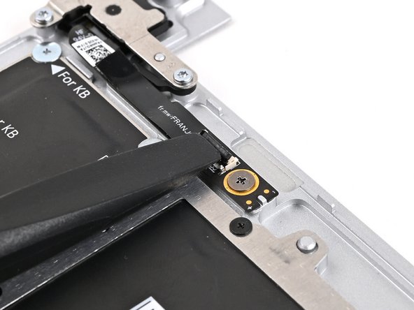 Use the flat end of your Framework Screwdriver, or a clean fingernail, to lift up the locking tab on the Fingerprint Reader ZIF connector located on the Fingerprint Reader board.