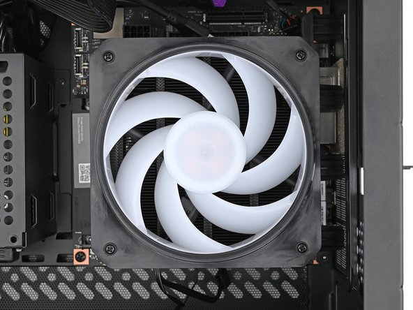 Use your Framework Desktop Screwdriver to install the four 27.3 mm‑long Phillips screws securing the CPU fan and fan duct.