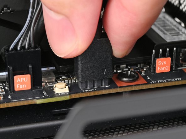 Use your fingers to slide the RGB cable over the three pronged connector located to the right of the &quot;APU Fan&quot; connector.